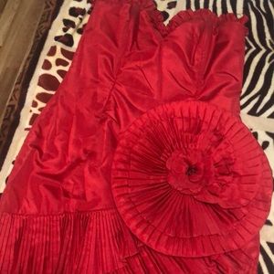Party dress size 10, color red, no tags, worn once.